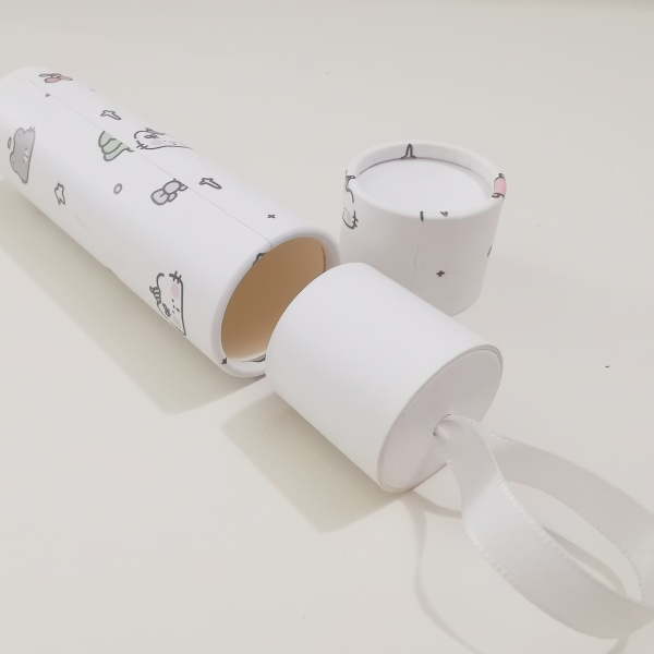 push-up paper tube with ribbon on bottom